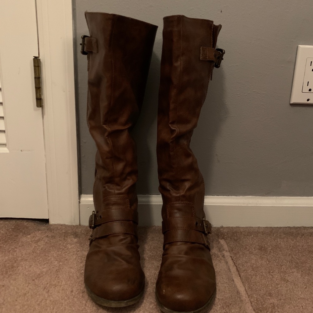Brown knee high boots.